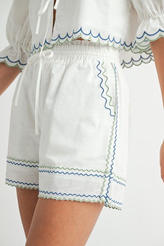 Set blanco borde azul y verde